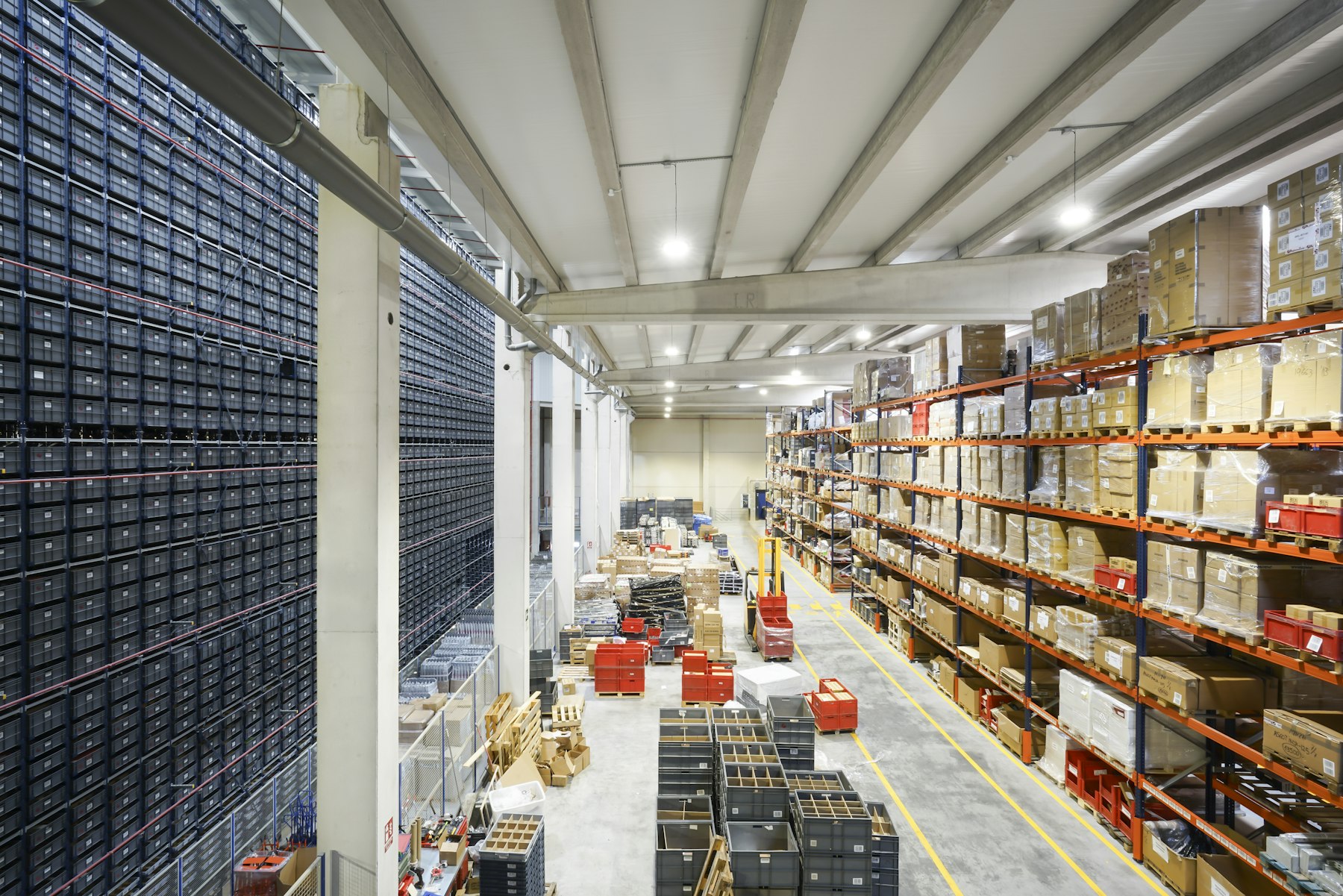 Large warehouse filled with boxes and inventory racks